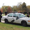cadets working near a patrol car