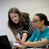A teacher helping a student